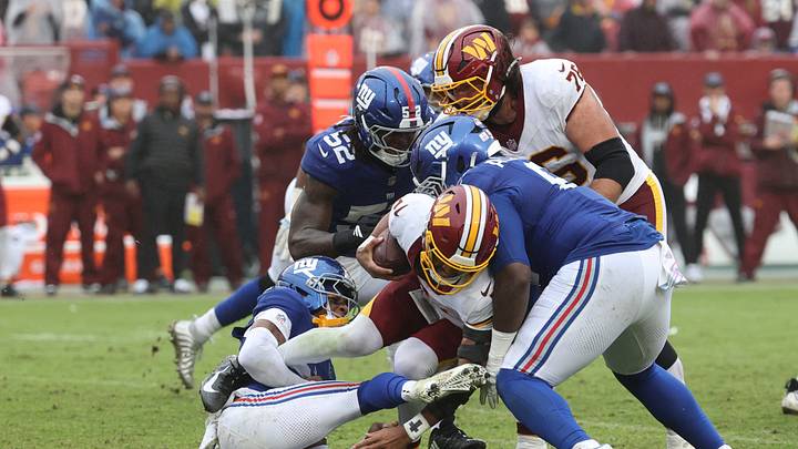 Oct 11, 2026; Landover, Maryland, USA; Washington Commanders quarterback Jayden Daniels (5) is sacked by New York Giants cornerback Dru Phillips (22) during the fourth quarter at Northwest Stadium. Oct 11, 2026; Landover, Maryland, USA; Washington Commanders quarterback Jayden Daniels (5) is sacked by New York Giants cornerback Dru Phillips (22) during the fourth quarter at Northwest Stadium.