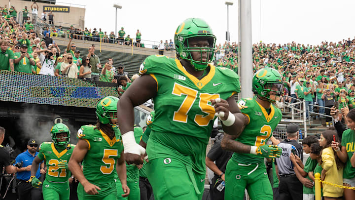 Oregon’s Emmanuel Pregnon, center, takes the field before the game against Oklahoma State at Autzen. Oregon’s Emmanuel Pregnon, center, takes the field before the game against Oklahoma State at Autzen.