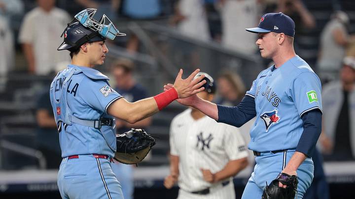 May 20, 2026; Bronx, New York, USA; Toronto Blue Jays catcher Brandon Valenzuela (59) celebrates with pitcher Louis Varland (77) after the game against the New York Yankees at Yankee Stadium. Mandatory Credit: Vincent Carchietta-Imagn Images