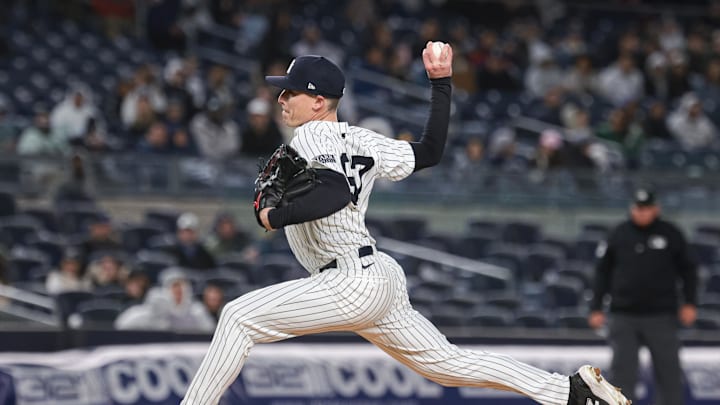 Apr 23, 2024; Bronx, New York, USA; New York Yankees relief pitcher Ron Marinaccio (97) delivers a pitch during the sixth inning against the Oakland Athletics at Yankee Stadium. Mandatory Credit: Vincent Carchietta-Imagn Images