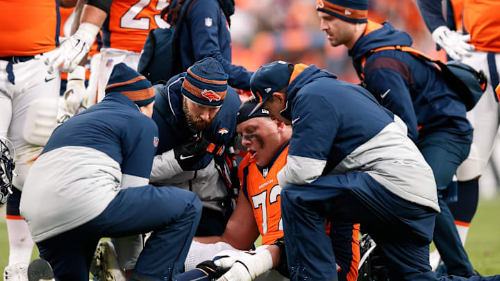 Oct 31, 2021; Denver, Colorado, USA; Denver Broncos offensive tackle Garett Bolles (72) is tended to