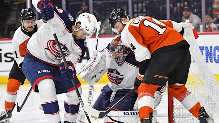Jan 4, 2024; Philadelphia, Pennsylvania, USA; Columbus Blue Jackets defenseman Ivan Provorov (9) and goaltender Daniil Tarasov (40) battle for the puck with Philadelphia Flyers center Sean Couturier (14) during the third period at Wells Fargo Center. Mandatory Credit: Eric Hartline-Imagn Images