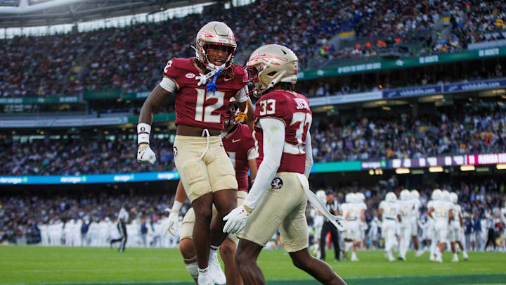 Aug 24, 2024; Dublin, IRL; Florida State University defensive back Edwin Joseph celebrates a tackle against Georgia Tech with defensive back Conrad Hussey at Aviva Stadium. Mandatory Credit: Tom Maher/INPHO via Imagn Images