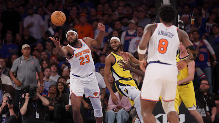 May 6, 2024; New York, New York, USA; New York Knicks center Mitchell Robinson (23) grabs a rebound against Indiana Pacers forward Isaiah Jackson (22) during the fourth quarter of game one of the second round of the 2024 NBA playoffs at Madison Square Garden. Mandatory Credit: Brad Penner-Imagn Images