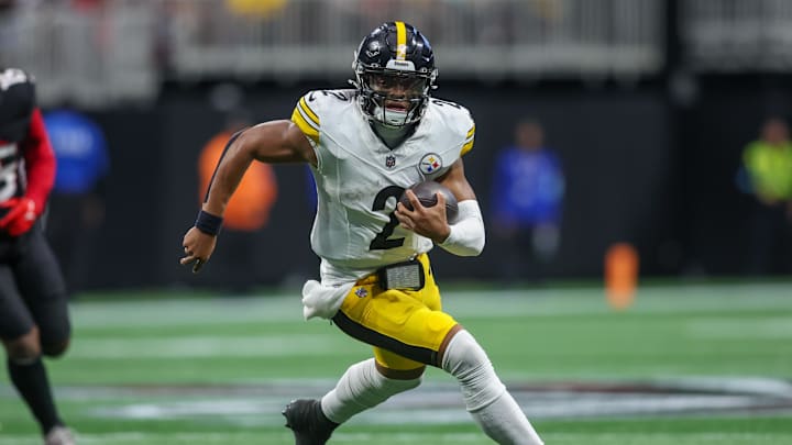 Sep 8, 2024; Atlanta, Georgia, USA; Pittsburgh Steelers quarterback Justin Fields (2) runs the ball against the Atlanta Falcons in the third quarter at Mercedes-Benz Stadium. Mandatory Credit: Brett Davis-Imagn Images