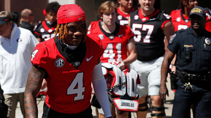 Georgia defensive back KJ Bolden (4) arrives with the team before the start of the G-Day spring football game in Athens, Ga., on Saturday, April 13, 2024.