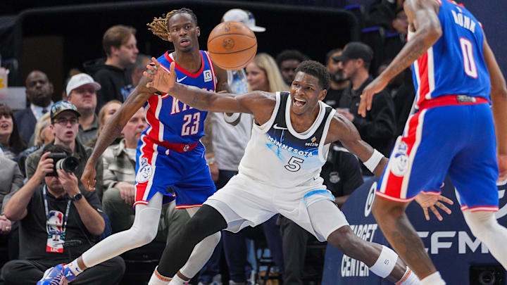 Nov 27, 2024; Minneapolis, Minnesota, USA; Minnesota Timberwolves guard Anthony Edwards (5) is fouled by Sacramento Kings guard Keon Ellis (23) in the third quarter at Target Center. Mandatory Credit: Brad Rempel-Imagn Images