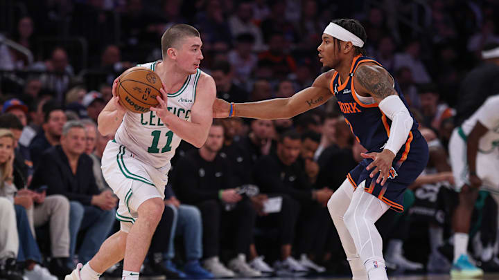 May 12, 2025; New York, New York, USA; Boston Celtics guard Payton Pritchard (11) is guarded by New York Knicks guard Miles McBride (2) in the first half during game four of the second round for the 2025 NBA Playoffs at Madison Square Garden. Mandatory Credit: Vincent Carchietta-Imagn Images