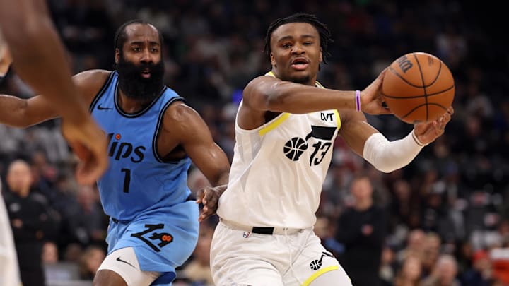 Feb 8, 2025; Inglewood, California, USA;  Utah Jazz guard Isaiah Collier (13) passes the ball against Los Angeles Clippers guard James Harden (1) during the first quarter at Intuit Dome. Mandatory Credit: Kiyoshi Mio-Imagn Images