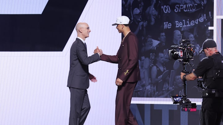 Jun 25, 2025; Brooklyn, NY, USA;  Carter Bryant stands with NBA commissioner Adam Silver after being selected as the 14th pick by the San Antonio Spurs in the first round of the 2025 NBA Draft at Barclays Center. Mandatory Credit: Brad Penner-Imagn Images