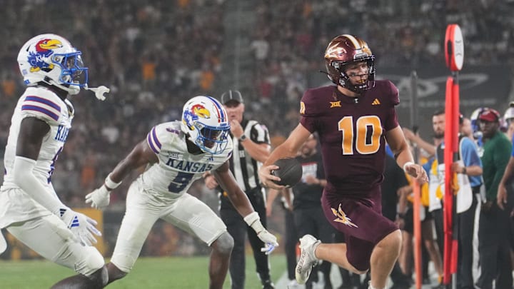 Arizona State quarterback Sam Leavitt (10) scrambles out of bounds against the Kansas Jayhawks at Mountain America Stadium on Oct. 5, 2024.