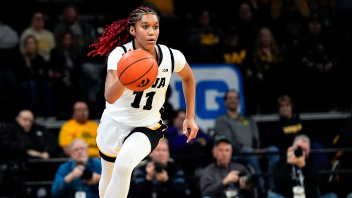 Iowa guard Aaliyah Guyton (11) brings the ball up court against the Northwestern Wildcats Tuesday, Jan. 28, 2025 at Carver-Hawkeye Arena in Iowa City, Iowa. Iowa guard Aaliyah Guyton (11) brings the ball up court against the Northwestern Wildcats Tuesday, Jan. 28, 2025 at Carver-Hawkeye Arena in Iowa City, Iowa.