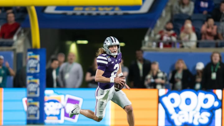 Dec 28, 2023; Orlando, FL, USA; Kansas State quarterback Avery Johnson (2) runs the ball against NC State in the fourth quarter at Camping World Stadium. Mandatory Credit: Jeremy Reper-USA TODAY Sports Dec 28, 2023; Orlando, FL, USA; Kansas State quarterback Avery Johnson (2) runs the ball against NC State in the fourth quarter at Camping World Stadium. Mandatory Credit: Jeremy Reper-USA TODAY Sports
