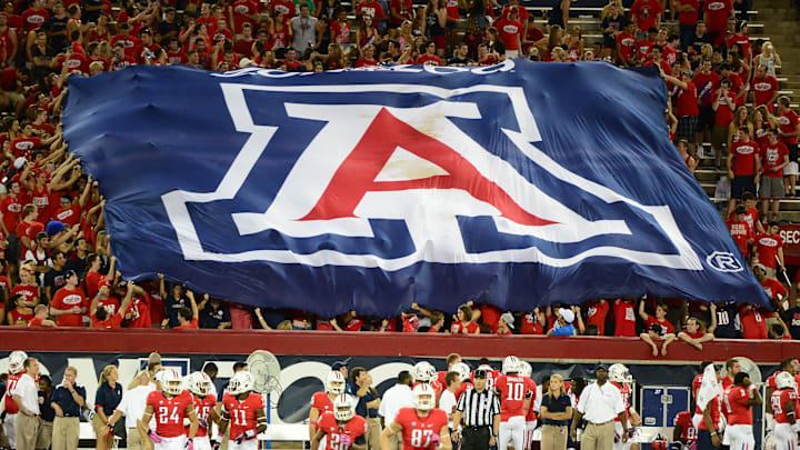 Oct. 20, 2012; Tucson, AZ, USA; Arizona Wildcats fans in the grandstands display a flag in the crowd against the Washington Huskies at Arizona Stadium. Mandatory Credit: Mark J. Rebilas-Imagn Images