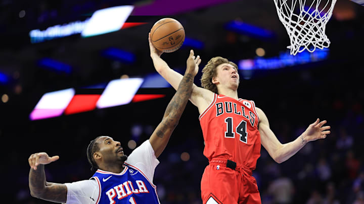 Feb 24, 2025; Philadelphia, Pennsylvania, USA; Chicago Bulls forward Matas Buzelis (14) drives and misses a dunk in front of Philadelphia 76ers center Andre Drummond (1) during the fourth quarter at Wells Fargo Center. Mandatory Credit: Bill Streicher-Imagn Images