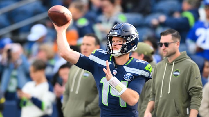 Nov 9, 2025; Seattle, Washington, USA; Seattle Seahawks quarterback Sam Darnold (14) warms up before the game against the Arizona Cardinals  at Lumen Field. Mandatory Credit: Steven Bisig-Imagn Images