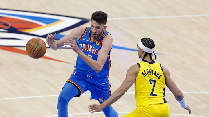 Oklahoma City Thunder forward Chet Holmgren (7) and Indiana Pacers guard Andrew Nembhard (2) battle for control of the ball during the first quarter of game two of the 2025 NBA Finals at Paycom Center.