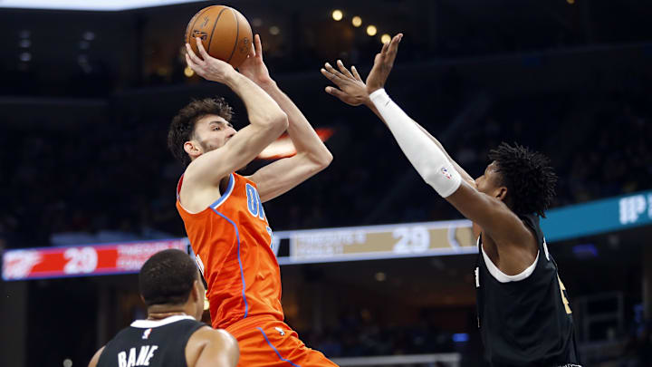 Mar 16, 2024; Memphis, Tennessee, USA; Oklahoma City Thunder forward Chet Holmgren (7) shoots as Memphis Grizzlies forward GG Jackson (45) defends during the first half at FedExForum. Mandatory Credit: Petre Thomas-Imagn Images
