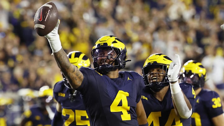 Aug 30, 2025; Ann Arbor, Michigan, USA;  Michigan Wolverines edge TJ Guy (4) celebrates a fumble recovery in the first half against the New Mexico Lobos at Michigan Stadium. Mandatory Credit: Rick Osentoski-Imagn Images