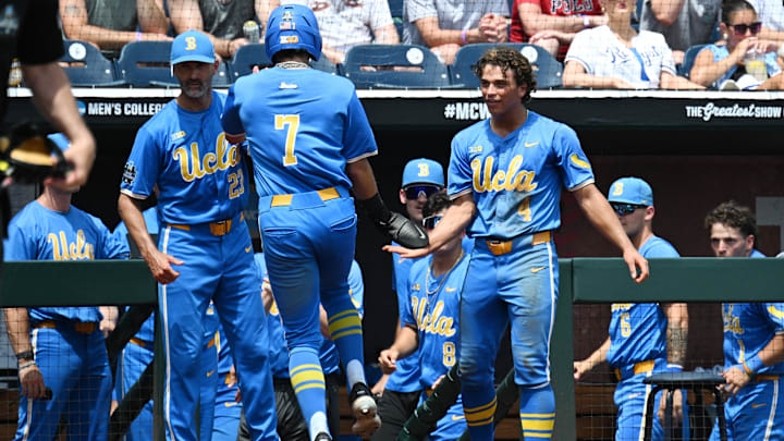 Jun 14, 2025; Omaha, Neb, USA; UCLA Bruins third baseman Roman Martin (7) celebrates with teammates after scoring against the Murray State Racers during the fourth inning at Charles Schwab Field. Mandatory Credit: Steven Branscombe-Imagn Images Jun 14, 2025; Omaha, Neb, USA; UCLA Bruins third baseman Roman Martin (7) celebrates with teammates after scoring against the Murray State Racers during the fourth inning at Charles Schwab Field. Mandatory Credit: Steven Branscombe-Imagn Images