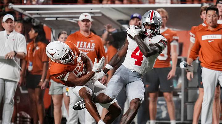 Ohio State Buckeyes wide receiver Jeremiah Smith (4) catches a pass in front of Texas Longhorns defensive back Warren Roberson (24) during the NCAA football game at Darrell K Royal–Texas Memorial Stadium in Austin, Texas on Sept. 12, 2026. Ohio State Buckeyes wide receiver Jeremiah Smith (4) catches a pass in front of Texas Longhorns defensive back Warren Roberson (24) during the NCAA football game at Darrell K Royal–Texas Memorial Stadium in Austin, Texas on Sept. 12, 2026.
