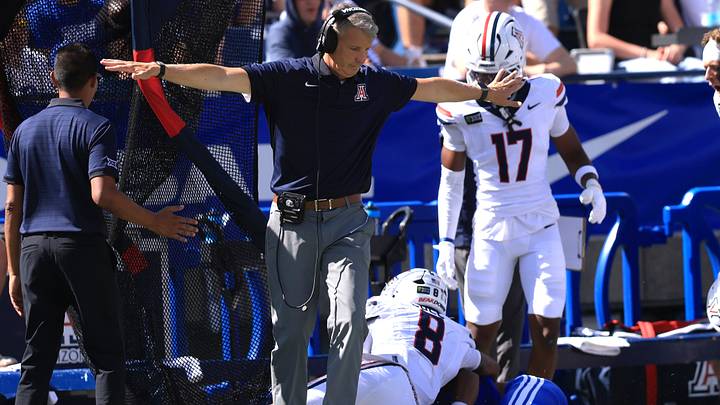 Sep 12, 2026; Provo, Utah, USA;  Arizona Wildcats head coach Brent Brennan reacts to a play against the BYU Cougars during the second quarter at LaVell Edwards Stadium. 
