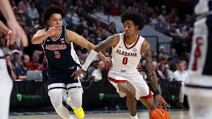Dec 13, 2025; Birmingham, Alabama, USA; Alabama Crimson Tide guard Labaron Philon (0) dribbles against Arizona Wildcats guard Brayden Burries (5) during the first half at Legacy Arena at BJCC. Mandatory Credit: David Leong-Imagn Images Dec 13, 2025; Birmingham, Alabama, USA; Alabama Crimson Tide guard Labaron Philon (0) dribbles against Arizona Wildcats guard Brayden Burries (5) during the first half at Legacy Arena at BJCC. Mandatory Credit: David Leong-Imagn Images