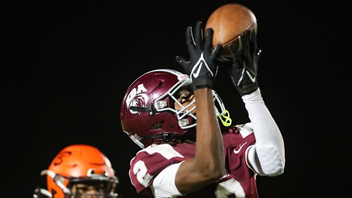 First Baptist Academy Lions receiver Bradley Martino (2) catches a pass during the third quarter of the Class 1A regional semifinal against the Benjamin Buccaneers at First Baptist Academy in Naples on Friday, Nov. 22, 2024.