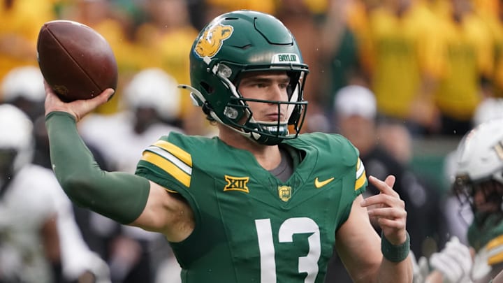 Nov 1, 2025; Waco, Texas, USA; Baylor Bears quarterback Sawyer Robertson (13) throws downfield against the UCF Knights during the first half at McLane Stadium. Mandatory Credit: Raymond Carlin III-Imagn Images