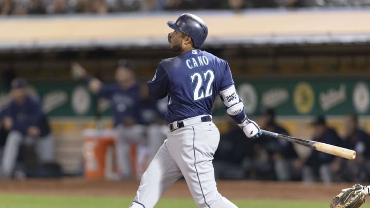Aug 31, 2018; Oakland, CA, USA; Seattle Mariners second baseman Robinson Cano (22) hits a home run during the fourth inning against the Oakland Athletics at Oakland Coliseum. Mandatory Credit: Neville E. Guard-USA TODAY Sports
