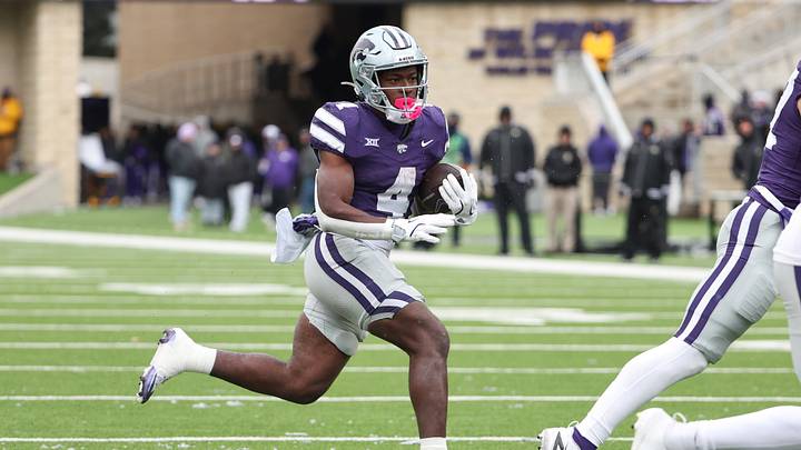 Nov 29, 2025; Manhattan, Kansas, USA; Kansas State Wildcats running back Joe Jackson (4) finds room to run during the fourth quarter against the Colorado Buffaloes at Bill Snyder Family Football Stadium. Mandatory Credit: Scott Sewell-Imagn Images