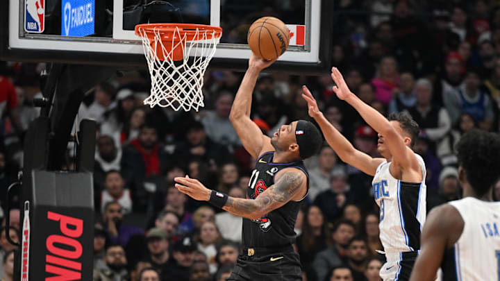 Jan 21, 2025; Toronto, Ontario, CAN; Toronto Raptors guard Bruce Brown (11) scores against Orlando Magic guard Jett Howard (13) in the first half at Scotiabank Arena. Mandatory Credit: Dan Hamilton-Imagn Images Jan 21, 2025; Toronto, Ontario, CAN; Toronto Raptors guard Bruce Brown (11) scores against Orlando Magic guard Jett Howard (13) in the first half at Scotiabank Arena. Mandatory Credit: Dan Hamilton-Imagn Images
