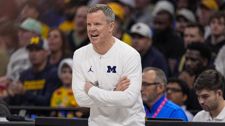 Dec 18, 2024; Charlotte, North Carolina, USA; Michigan Wolverines head coach Dusty May during the first half against the Oklahoma Sooners at Spectrum Center. Mandatory Credit: Jim Dedmon-Imagn Images