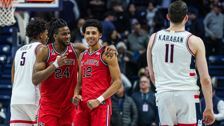 Feb 7, 2025; Storrs, Connecticut, USA;St. St. John's basketball forward Zuby Ejiofor (24) and guard RJ Luis Jr. (12) react after defeating the UConn Huskies in the second half at Harry A. Gampel Pavilion.