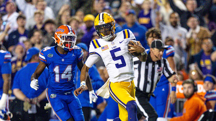 Nov 11, 2023; Baton Rouge, Louisiana, USA;  LSU Tigers quarterback Jayden Daniels (5) rushes for a