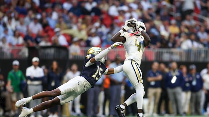 Oct 19, 2024; Atlanta, Georgia, USA; Georgia Tech Yellow Jackets wide receiver Abdul Janneh Jr. (4) catches a ball past Notre Dame Fighting Irish cornerback Leonard Moore (15) in the third quarter at Mercedes-Benz Stadium. Mandatory Credit: Brett Davis-Imagn Images Oct 19, 2024; Atlanta, Georgia, USA; Georgia Tech Yellow Jackets wide receiver Abdul Janneh Jr. (4) catches a ball past Notre Dame Fighting Irish cornerback Leonard Moore (15) in the third quarter at Mercedes-Benz Stadium. Mandatory Credit: Brett Davis-Imagn Images