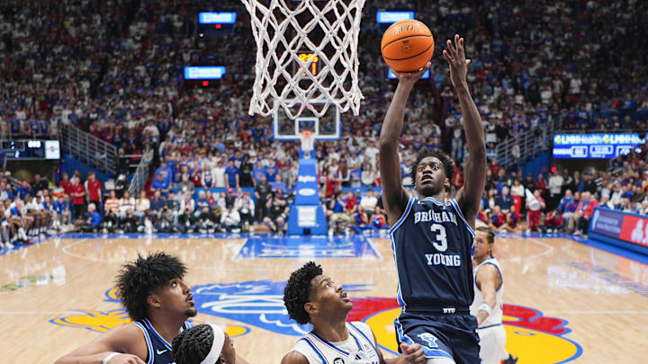 Jan 31, 2026; Lawrence, Kansas, USA; BYU Cougars forward AJ Dybantsa (3) shoots against Kansas Jayhawks forward Bryson Tiller (15) during the second half at Allen Fieldhouse. Mandatory Credit: Jay Biggerstaff-Imagn Images