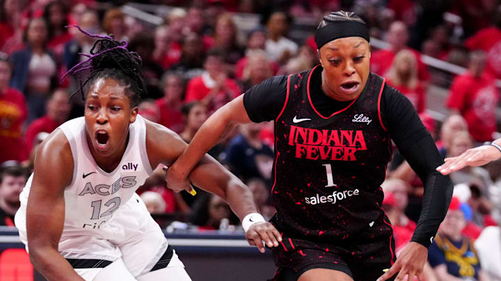 Las Vegas Aces guard Chelsea Gray (12) defends Indiana Fever guard Odyssey Sims (1) on September 28, 2025