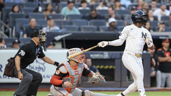 Jun 20, 2025; Bronx, New York, USA;  New York Yankees third baseman Jazz Chisholm Jr. (13) hits an RBI single in the first inning against the Baltimore Orioles at Yankee Stadium. Mandatory Credit: Wendell Cruz-Imagn Images