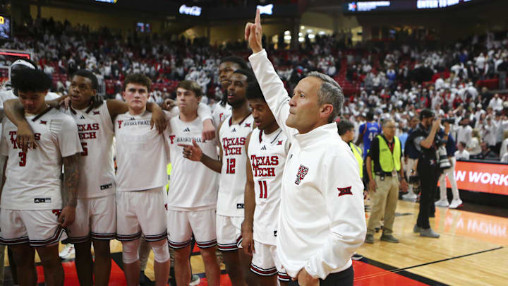 Feb 2, 2026; Lubbock, Texas, USA; Texas Tech Red Raiders head coach Grant McCasland sings the school song after the game against the Kansas Jayhawks at United Supermarkets Arena. Mandatory Credit: Michael C. Johnson-Imagn Images Feb 2, 2026; Lubbock, Texas, USA; Texas Tech Red Raiders head coach Grant McCasland sings the school song after the game against the Kansas Jayhawks at United Supermarkets Arena. Mandatory Credit: Michael C. Johnson-Imagn Images
