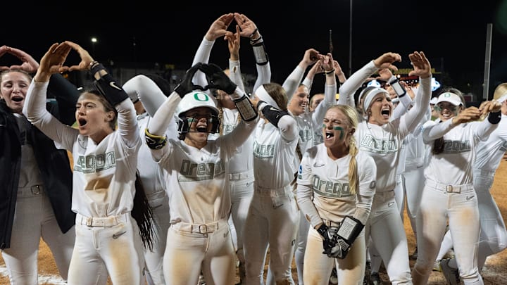 Oregon players celebrate their win against Stanford in the NCAA Eugene Softball Regional on May 18, 2025.