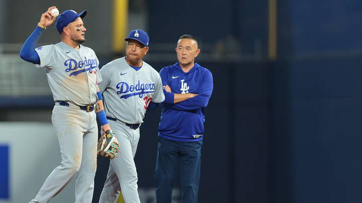 Sep 13, 2026; Miami, Florida, USA; Los Angeles Dodgers manager Dave Roberts (30) checks on second baseman Miguel Rojas (72) after a collision with shortstop Mookie Betts (not pictured) during the eighth inning at loanDepot Park. Mandatory Credit: Sam Navarro-Imagn Images Sep 13, 2026; Miami, Florida, USA; Los Angeles Dodgers manager Dave Roberts (30) checks on second baseman Miguel Rojas (72) after a collision with shortstop Mookie Betts (not pictured) during the eighth inning at loanDepot Park. Mandatory Credit: Sam Navarro-Imagn Images