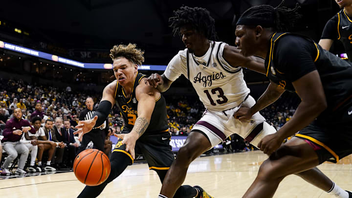 Feb 7, 2024; Columbia, Missouri, USA; Missouri Tigers forward Noah Carter (35) and guard Curt Lewis