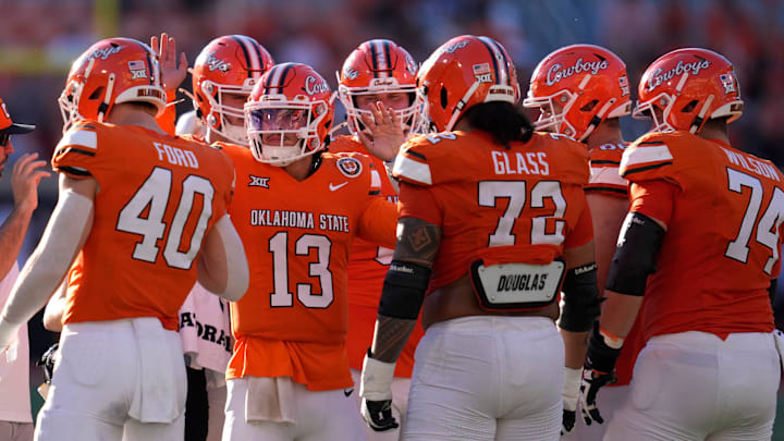Oklahoma State Cowboys quarterback Garret Rangel (13) huddles with players before entering the game during a college football game between the Oklahoma State Cowboys (OSU) and the West Virginia Mountaineers at Boone Pickens Stadium in Stillwater, Okla., Saturday, Oct. 5, 2024. Oklahoma State Cowboys quarterback Garret Rangel (13) huddles with players before entering the game during a college football game between the Oklahoma State Cowboys (OSU) and the West Virginia Mountaineers at Boone Pickens Stadium in Stillwater, Okla., Saturday, Oct. 5, 2024.