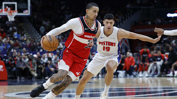 Nov 17, 2024; Washington, District of Columbia, USA; Washington Wizards forward Kyle Kuzma (33) drives to the basket as Detroit Pistons forward Simone Fontecchio (19) defends in the second half at Capital One Arena. Mandatory Credit: Geoff Burke-Imagn Images