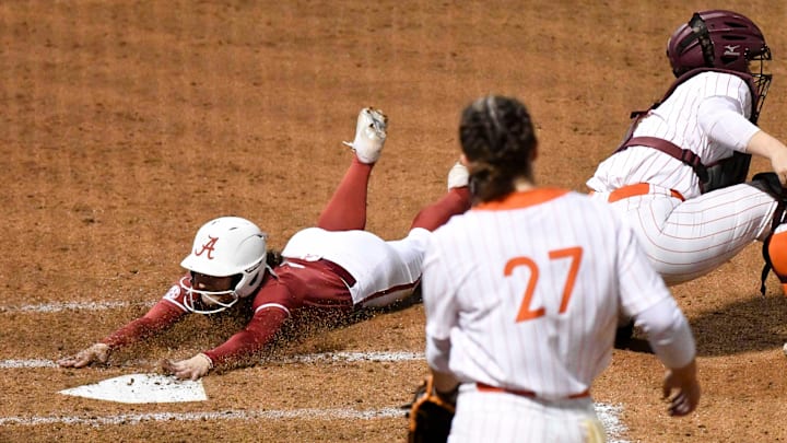 Mar 22, 2024; Tuscaloosa, Alabama, USA; Alabama base runner Kinley Pate (6) slides into home with the game’s only run at Rhoads Stadium Friday. Alabama defeated Virginia Tech 1-0.