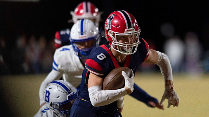 Heritage Hills' Tyler Ruxer (8) runs the ball as the Heritage Hills Patriots play the Batesville Bulldogs during the IHSAA Class 3A football semistate game at Heritage Hills High School in Lincoln City, Ind., Friday, Nov 22, 2024. Heritage Hills' Tyler Ruxer (8) runs the ball as the Heritage Hills Patriots play the Batesville Bulldogs during the IHSAA Class 3A football semistate game at Heritage Hills High School in Lincoln City, Ind., Friday, Nov 22, 2024.
