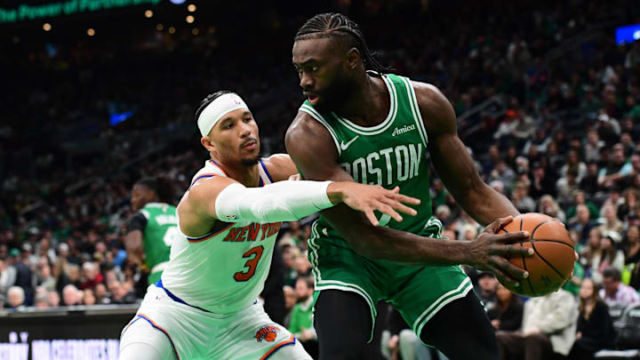 Feb 23, 2025; Boston, Massachusetts, USA;  New York Knicks guard Josh Hart (3) defends Boston Celtics guard Jaylen Brown (7) during the first half at TD Garden. Mandatory Credit: Bob DeChiara-Imagn Images