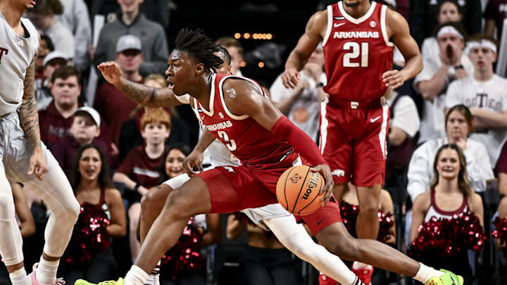 Feb 15, 2025; College Station, Texas, USA; Arkansas Razorbacks forward Adou Thiero (3) drives against Texas A&M Aggies guard Wade Taylor IV (4) during the first half at Reed Arena. Mandatory Credit: Maria Lysaker-Imagn Images 