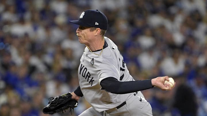Oct 26, 2024; Los Angeles, California, USA; New York Yankees pitcher Tim Hill (54) pitches in the fifth inning against the Los Angeles Dodgers during game two of the 2024 MLB World Series at Dodger Stadium. Mandatory Credit: Jayne Kamin-Oncea-Imagn Images